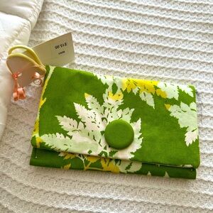 One of a kind clutch a happy little purse. New with tags.